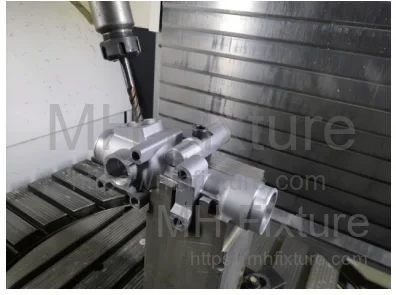 Single-setup machining configuration on a 5-axis CNC machine used for steering housing prototyping