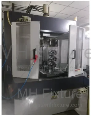 Horizontal machining center (HMC) setup showing the multi-station fixture in operation for high-volume production